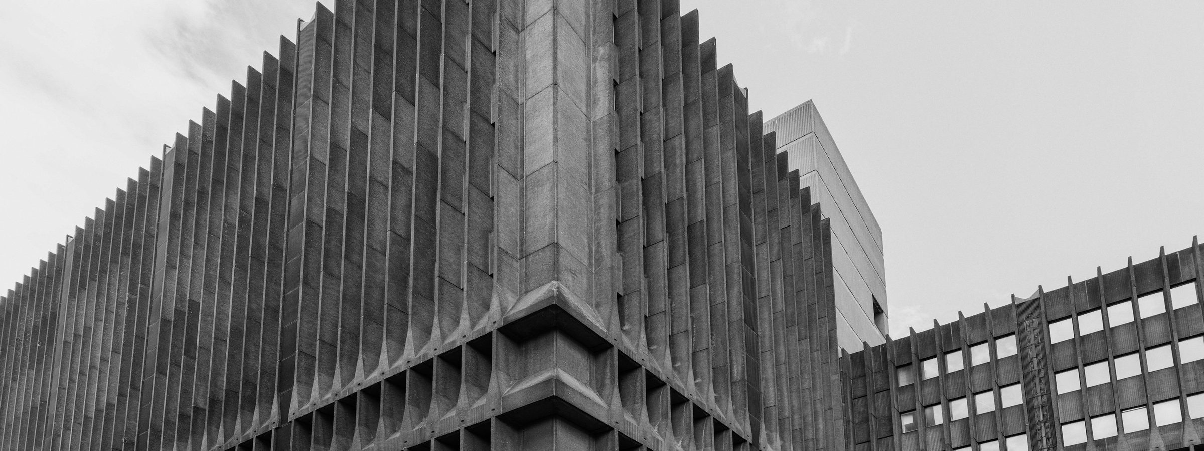 Brutalist concrete facade, geometric detail